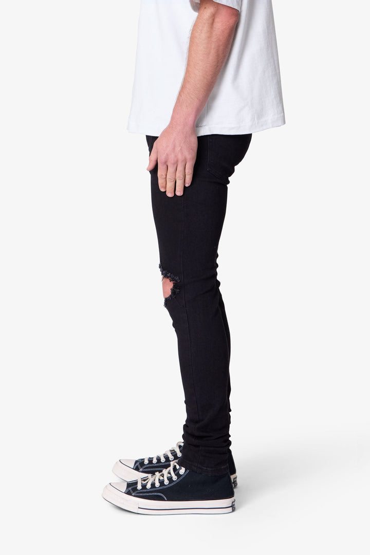 Jeans skinny uomo neri in denim con effetto sfumato, vestibilità aderente per stile streetwear unico.