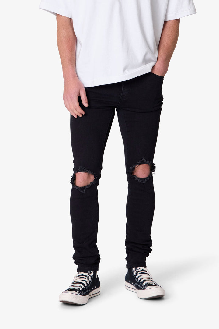 Jeans uomo skinny neri con effetto sfumato, vestibilità aderente per un look casual moderno in denim.