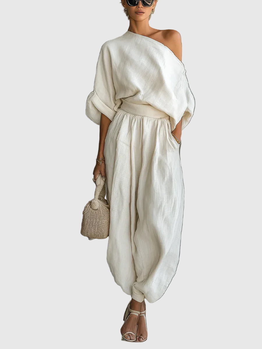 Completo due pezzi donna estivo elegante con top spalle scoperte, colore bianco sporco, perfetto per serate chic.