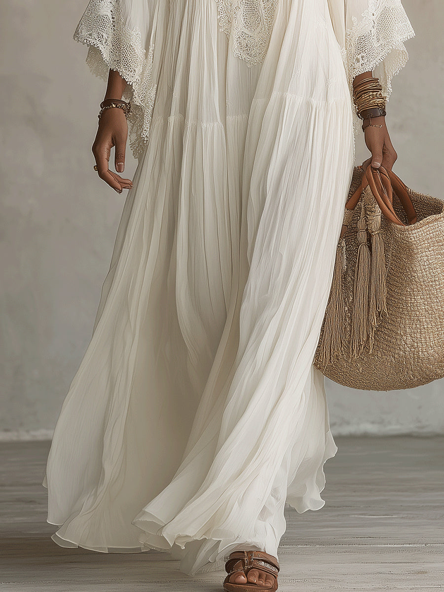 Abito bianco lungo da donna bohemien con pizzo e profondo scollo a V, perfetto per l'estate.
