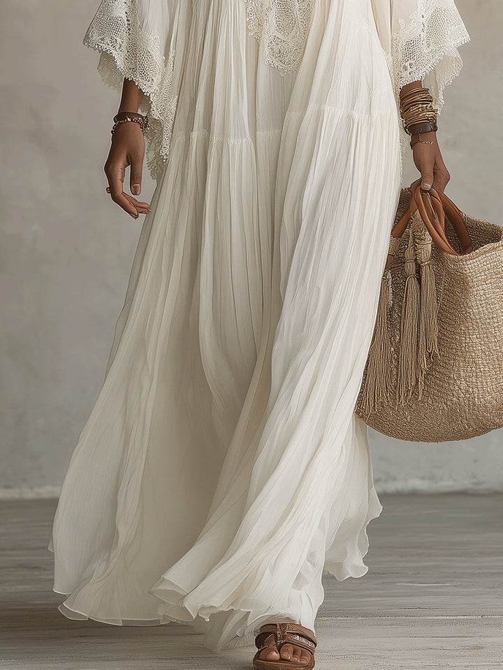 Abito bianco lungo da donna bohemien con pizzo e profondo scollo a V, perfetto per l'estate.