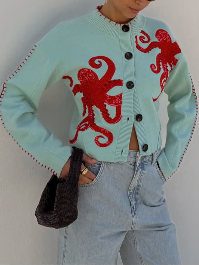 Originale cardigan donna azzurro in maglieria con distintivo motivo polpo, per un tocco unico al tuo stile casual.