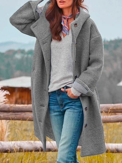 Moda inverno: cappotto lungo da donna rosa, caldo e antivento, perfetto per un look elegante e confortevole.