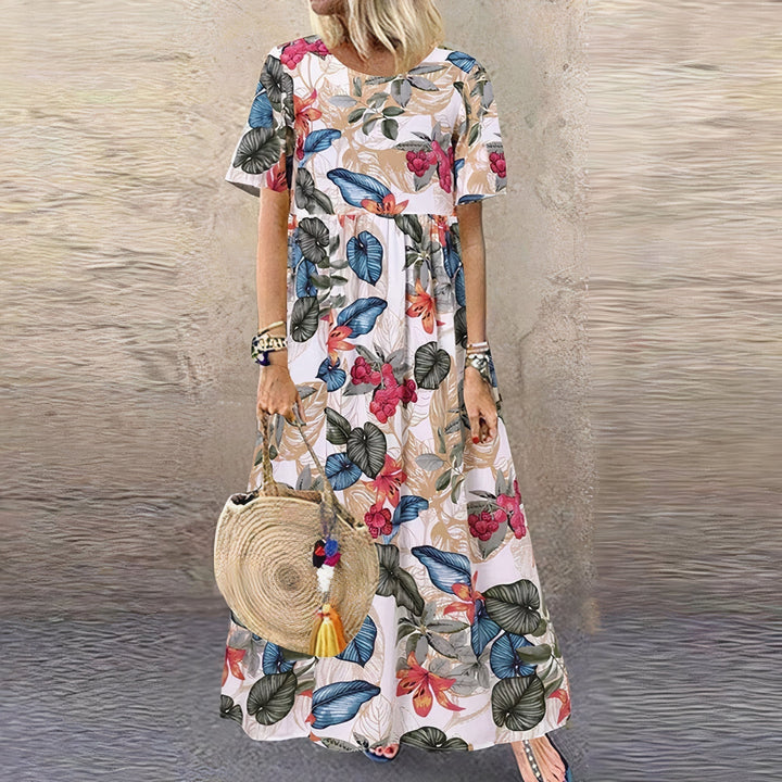 Vestito lungo da donna con fantasia floreale, ideale per un look casual e confortevole. Moda femminile versatile.
