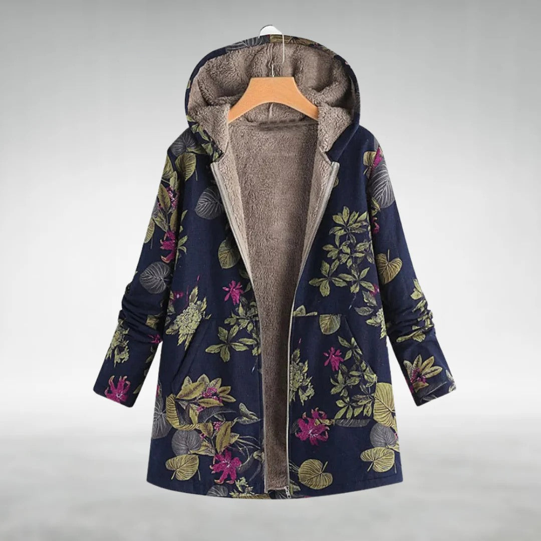 Elegante giacca lunga floreale da donna con cappuccio. Ideale per primavera, unisce comfort e stile casual.