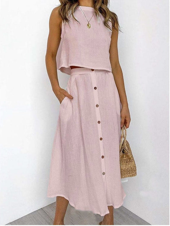 Elegante completo due pezzi donna con gilet e abito midi stampato a fantasia, vestibilità morbida.