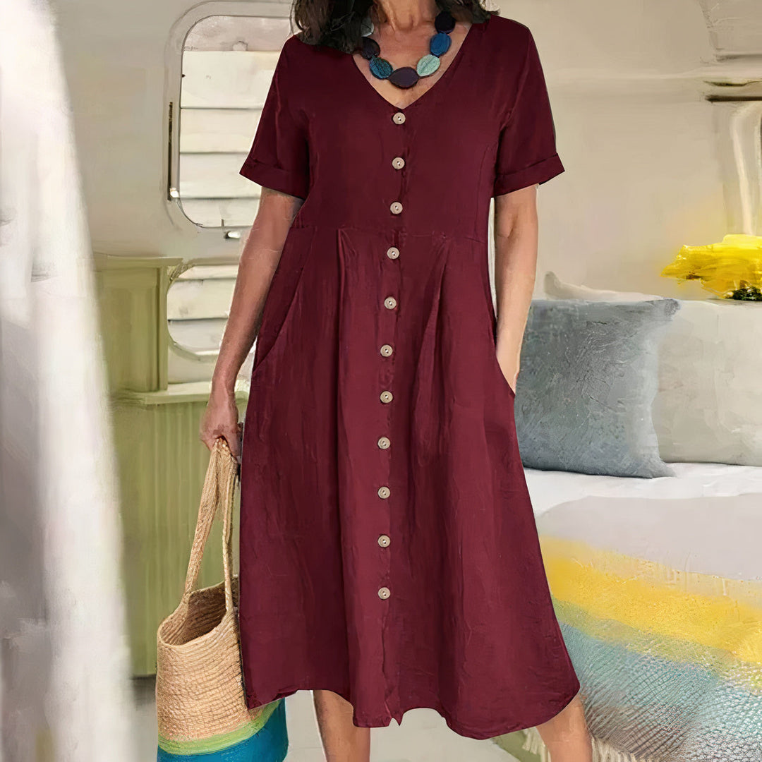 Abito estivo midi bianco da donna, leggero e comodo, ideale per la stagione calda e stile versatile.