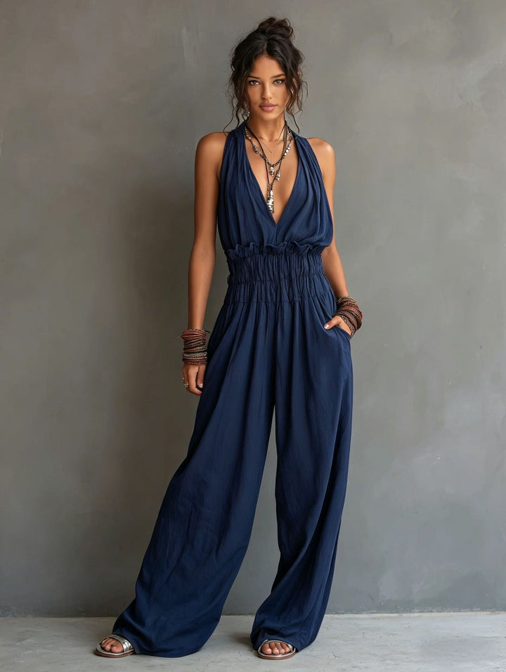 Tuta elegante da donna a vita alta con pantaloni ampi, scollo a V, un capo comodo e di tendenza per l'estate.