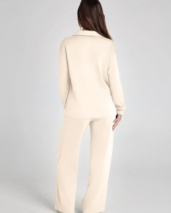 Elegante completo casual donna: felpa V-neck e pantaloni ampi, ideale per stile e comfort.