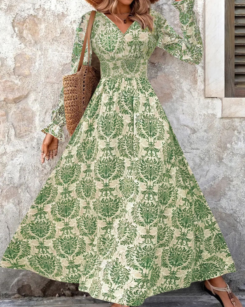 Abito autunnale donna con stampa, scollo a V, maniche lunghe, taglio comodo per eleganza casual.