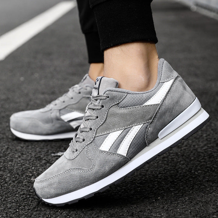 Calzature sportive uomo grigie, traspiranti e comode, perfette per corsa e attività outdoor leggere.