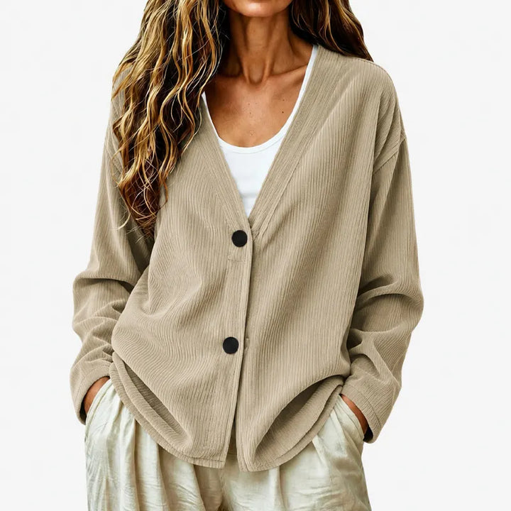 Cardigan nero donna elegante a coste, con scollo a V e bottoni. Versatile per autunno.