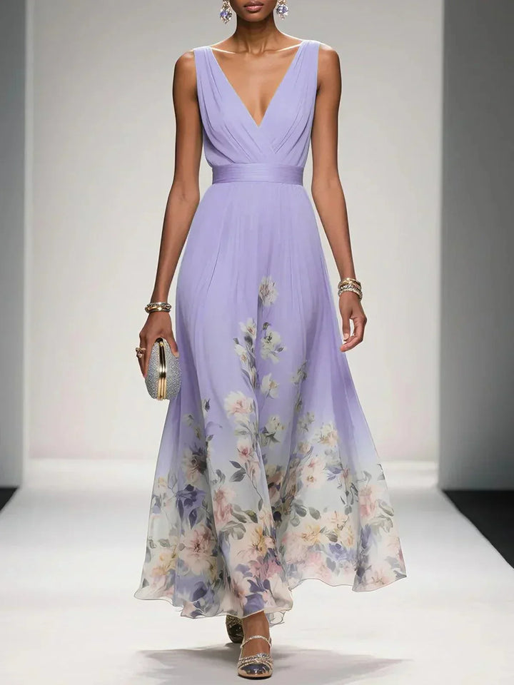 Vestito lungo floreale con scollo V, vestibilità fluida, ideale per eventi autunnali.