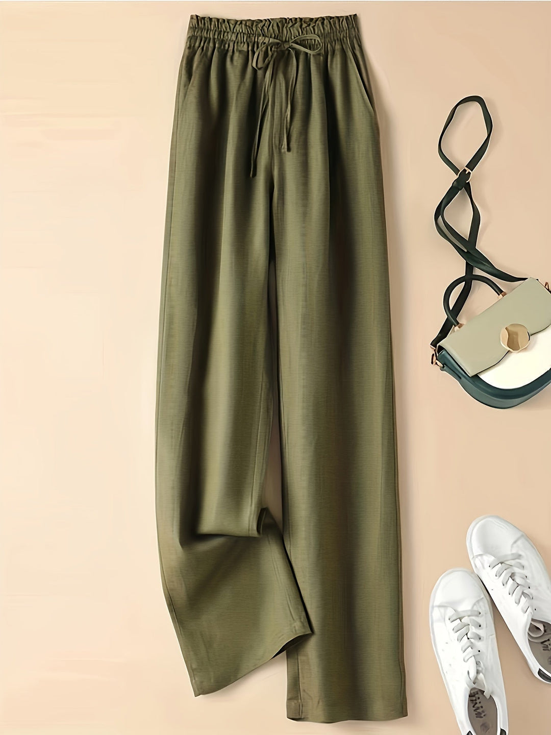 Pantaloni donna blu casual, vita alta con coulisse e tasche, perfetti per un look rilassato e chic.