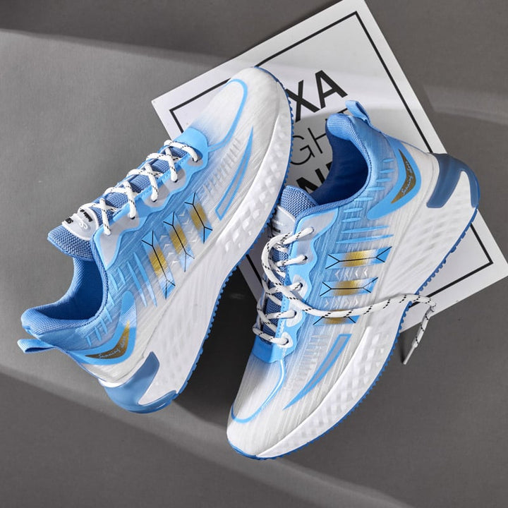 Sneakers uomo sportive azzurre con suola spessa, lacci e punta tonda. Offrono comfort e stile casual per la moda maschile.