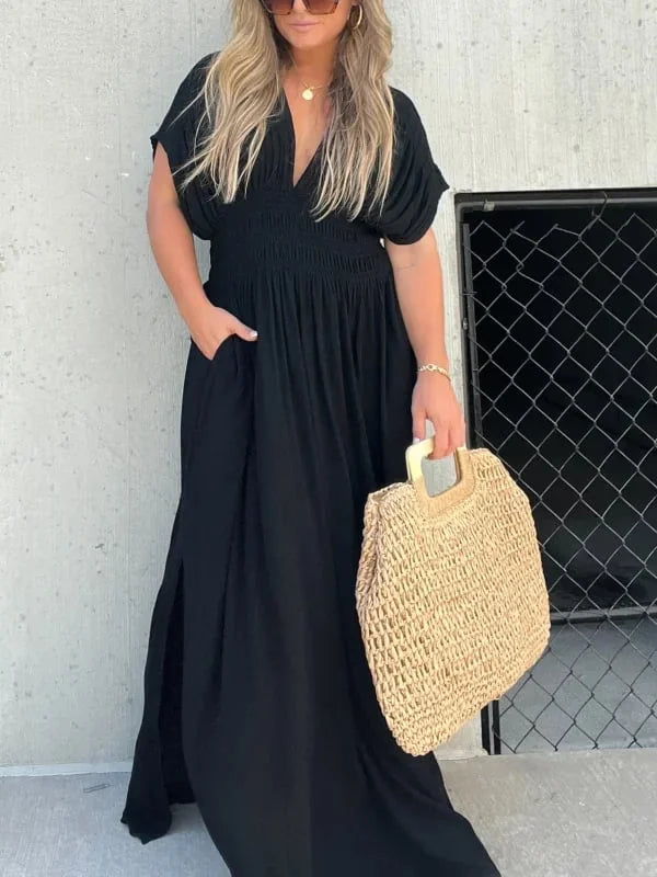 Vestito da sera donna nero, lungo, con profondo scollo a V e seducente spacco laterale.