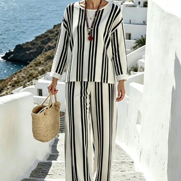 Set estivo donna con top asimmetrico ampio e shorts stampati coordinati, ideale per look vacanza.