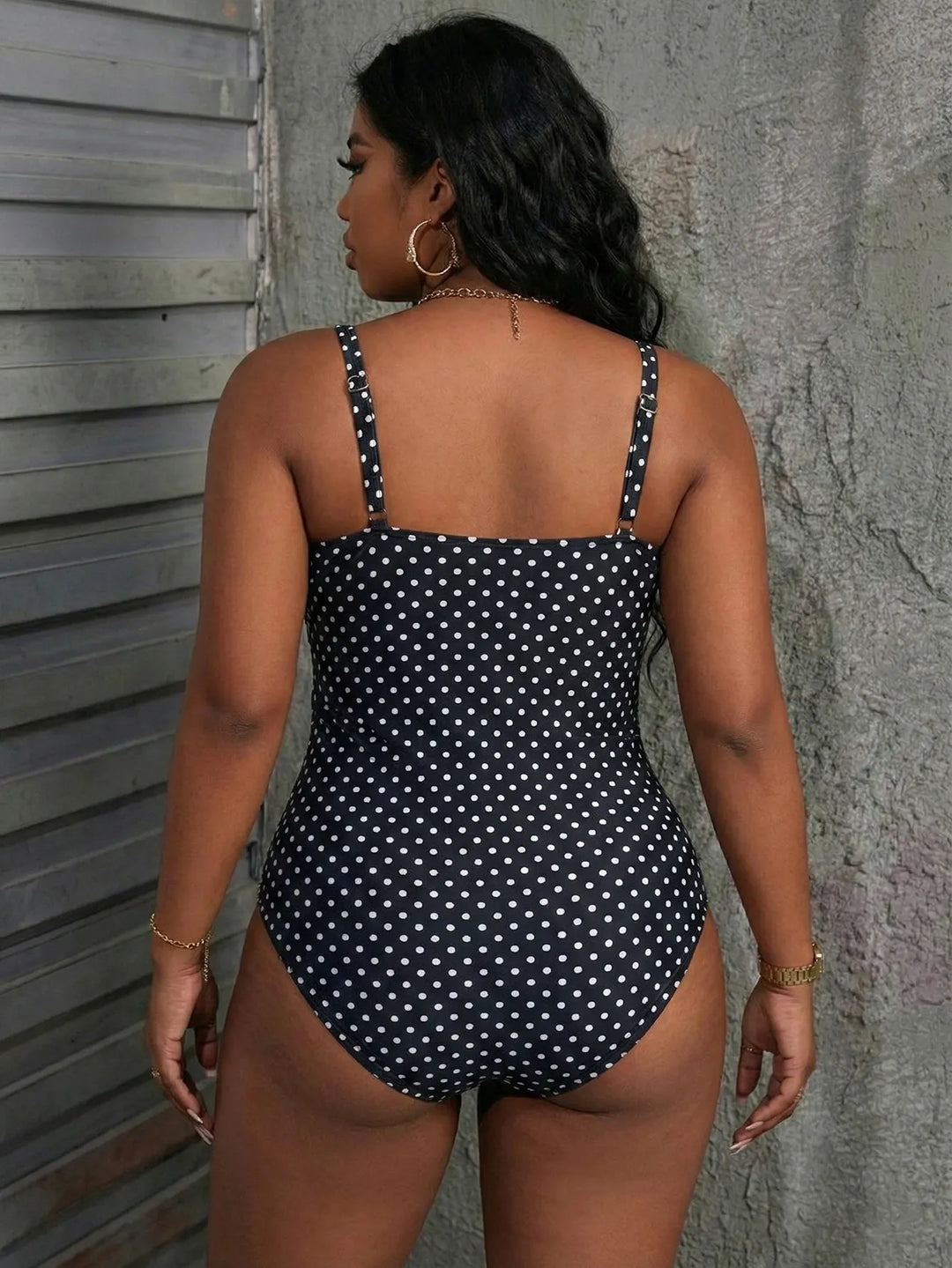 Elegante costume intero donna stampa palme, con dettagli in rete che valorizzano la silhouette.