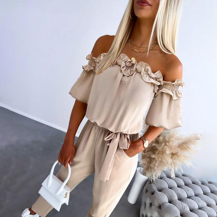 Tuta monospalla donna elegante con volant. Cintura in vita sottolinea la figura, ideale per serate speciali.