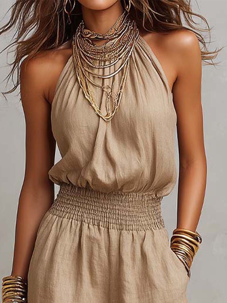 Tuta elegante donna con scollo halter profondo e pantaloni ampi, ideale per un look raffinato e moderno.