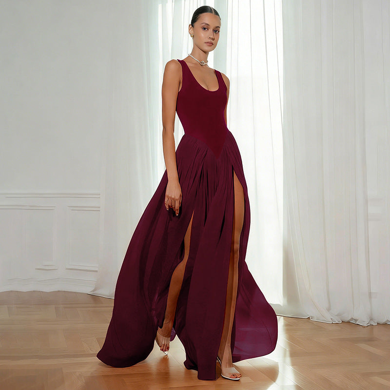 Abito lungo donna elegante senza maniche con orlo asimmetrico e dettagli a contrasto. Perfetto per serate.