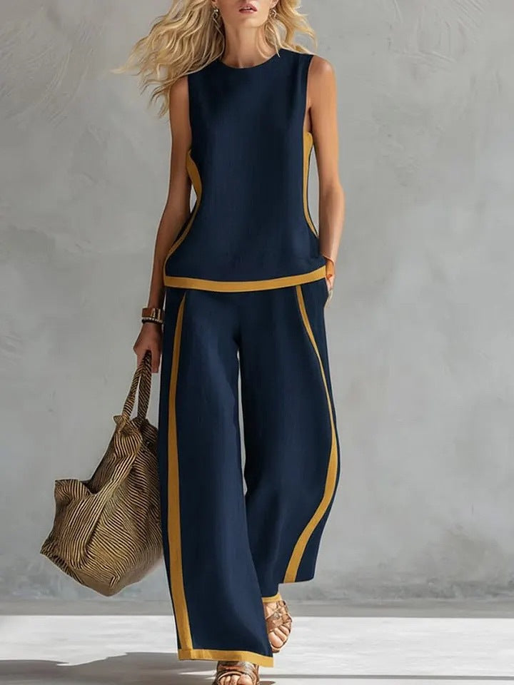 Set donna due pezzi alla moda: top color block e pantaloni larghi a vita alta, per un look casual chic estivo.