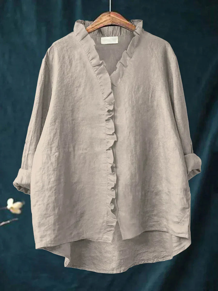Elegante camicia donna oversize con volant, bottoni e maniche regolabili, per ogni occasione.