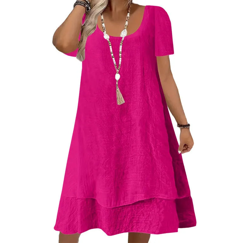Vestito primavera estate donna a maniche corte, collo rotondo, vestibilità ampia per un comfort estivo.
