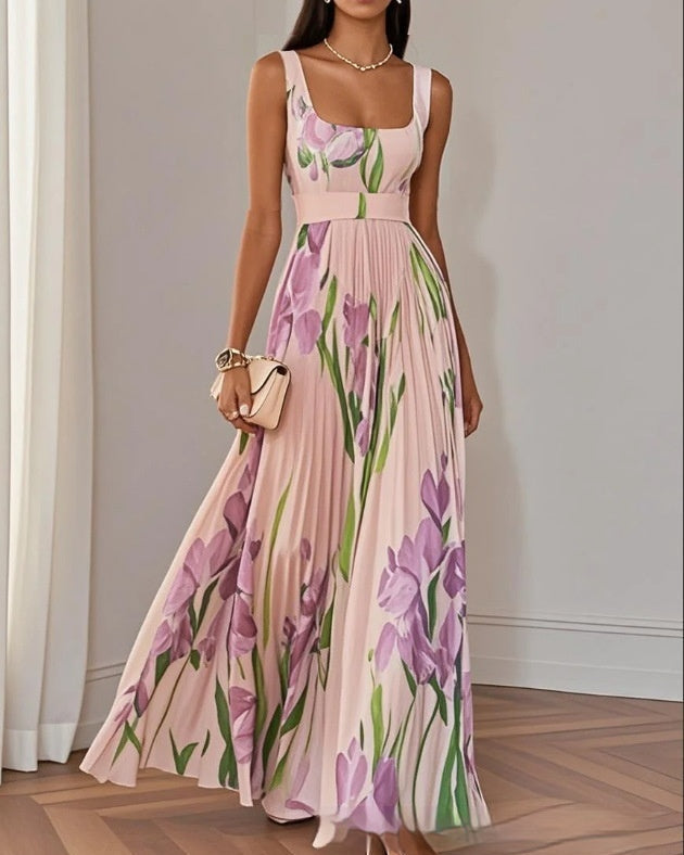 Abito estivo floreale plissettato da donna, spalline sottili e vita alta per una silhouette elegante e fresca.