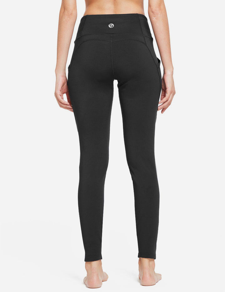 Leggings donna vita alta termici, con tasche laterali, supporto e comfort per lo sport.