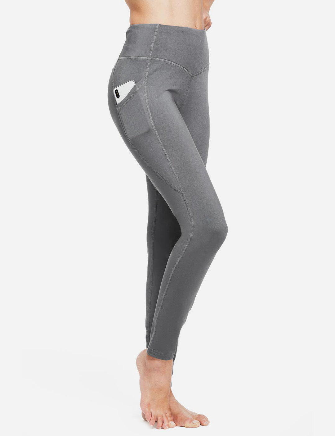 Leggings da corsa termici donna, vita alta, con tasche per gel e telefono.