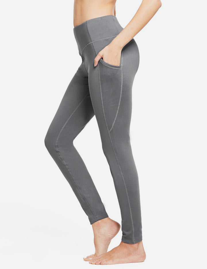 Leggings sportivi donna termici, calzamaglia con tasche per corsa ed escursionismo.