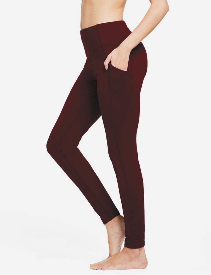 Leggings sportivi vita alta donna, termici, con tasche, per attività fisica intensa.