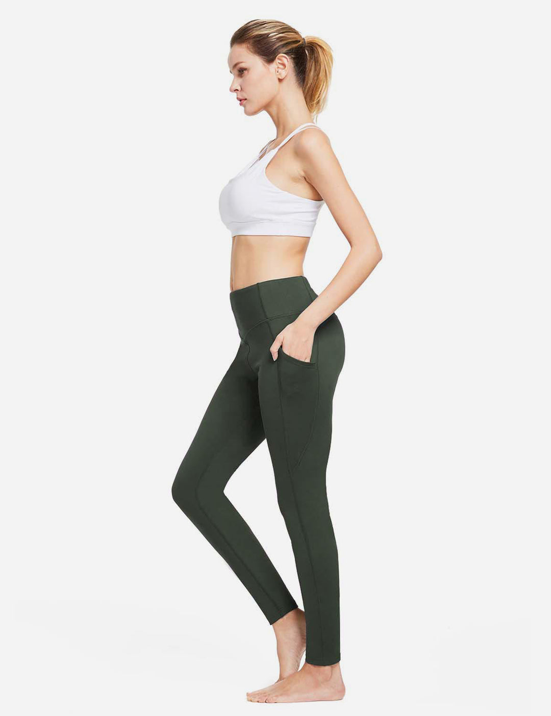 Leggings termici donna, vita alta compressiva, tasche, per sostegno durante lo sport.