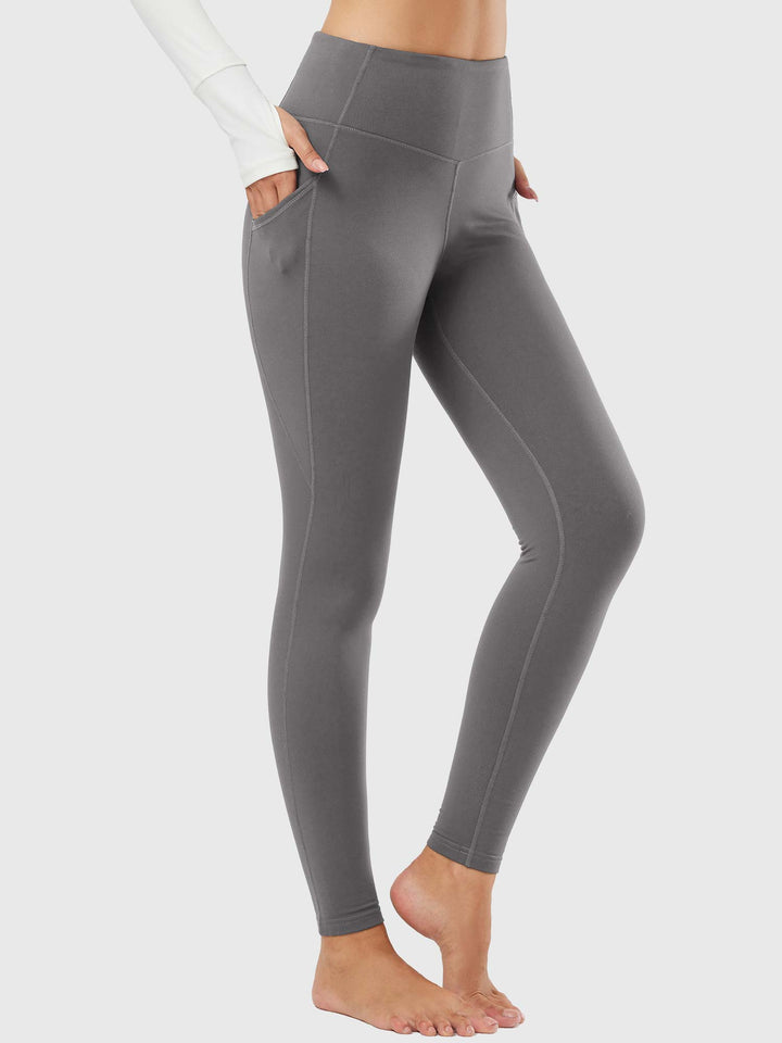Leggings invernali donna con tasche, vita alta, ideali per yoga e sport all'aperto.
