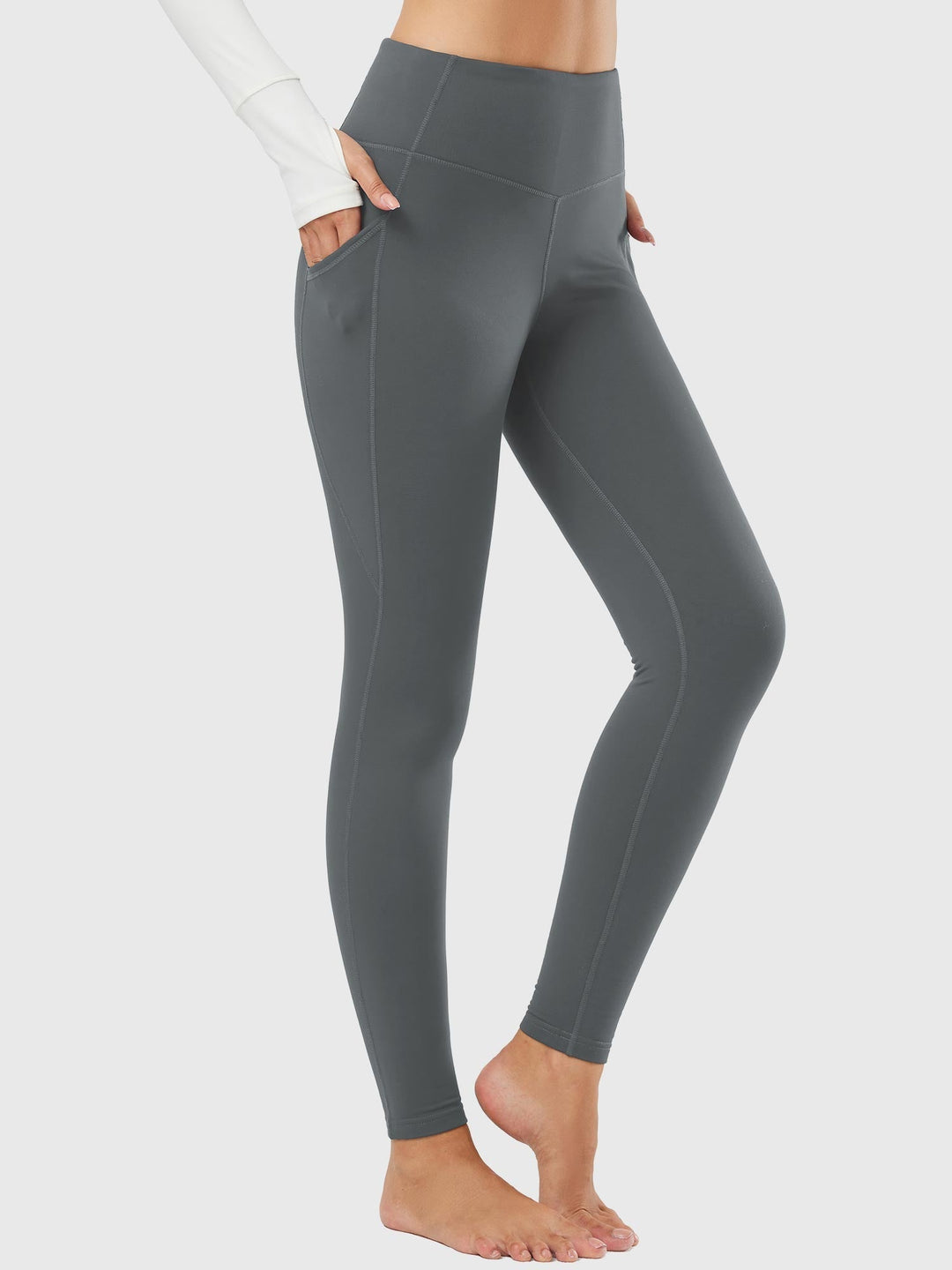 Activewear donna: leggings termici con tasche, caldi e comodi per lo sport.