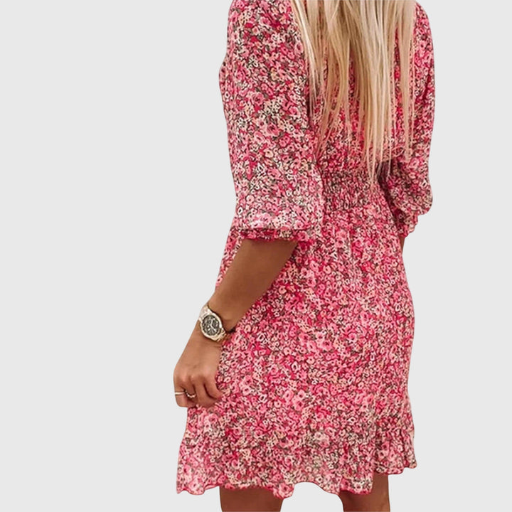 Abito donna estivo floreale, maniche a sbuffo, scollo a V, versatile per occasioni casual ed eleganti.