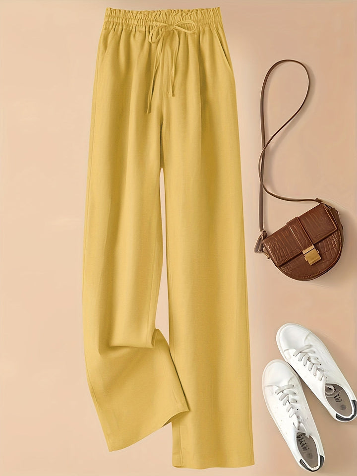 Moda donna: pantaloni casual beige, vita alta con coulisse, tessuto leggero per le giornate calde.