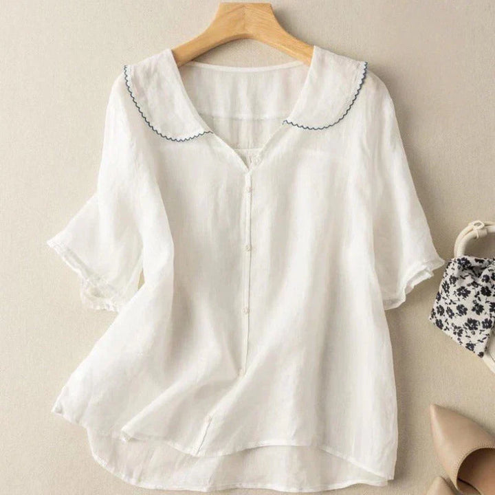Camicetta estiva da donna, fresca e leggera. Blusa casual con scollo a V e maniche corte, vestibilità comoda ed elegante.