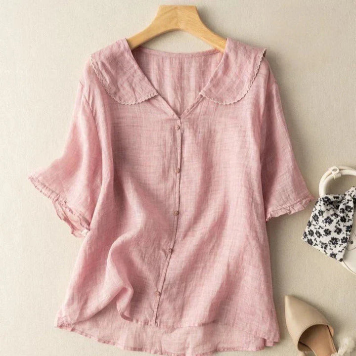 Blusa donna estiva casual con scollo a V e maniche corte. Camicetta fresca e versatile per giornate calde o outfit eleganti.