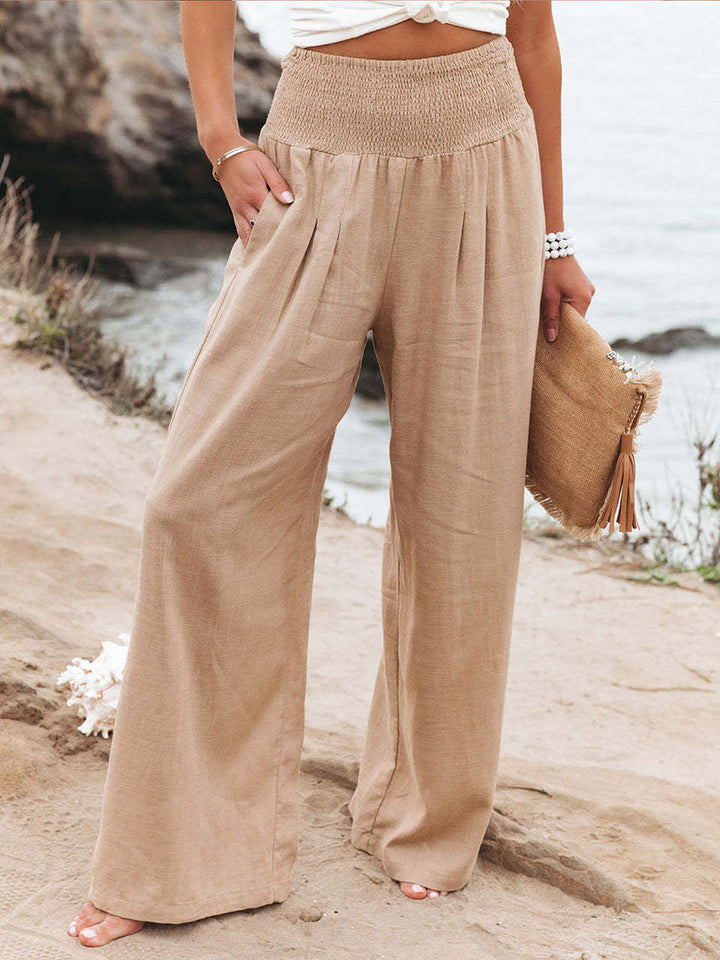Pantaloni donna vita alta e larghi, ideali per un look estivo rilassato ed elegante.