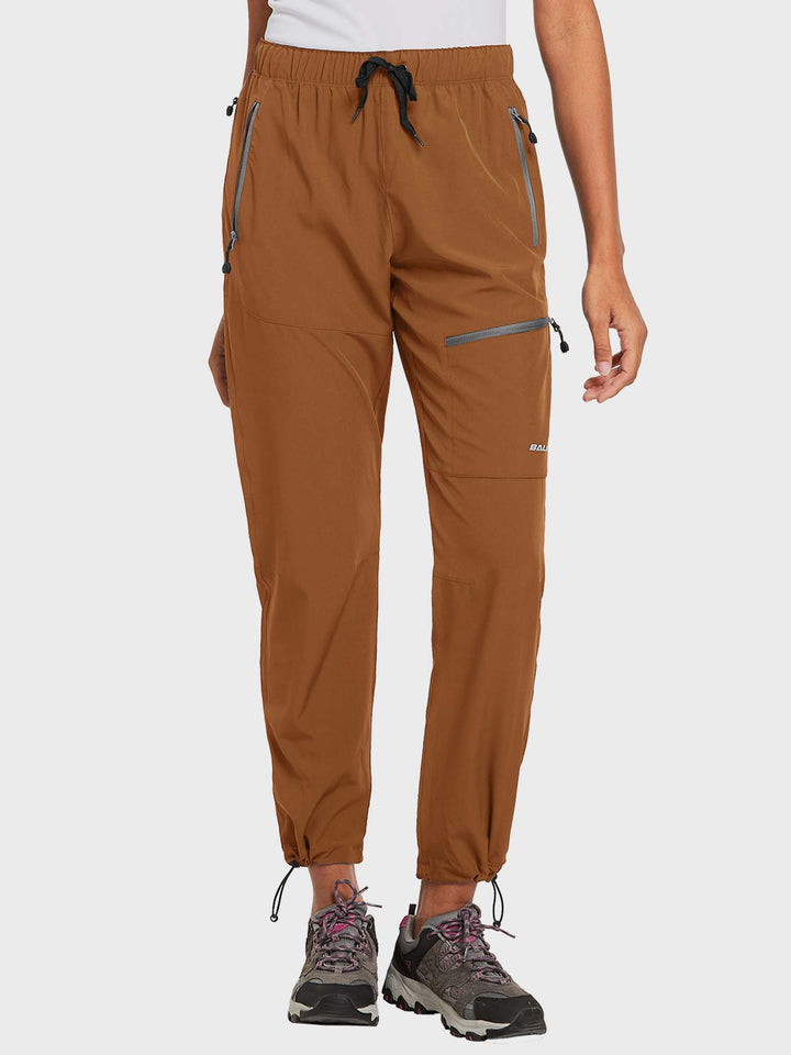 Pantaloni donna con tasche zip per sicurezza, ideali per viaggio ed escursionismo.
