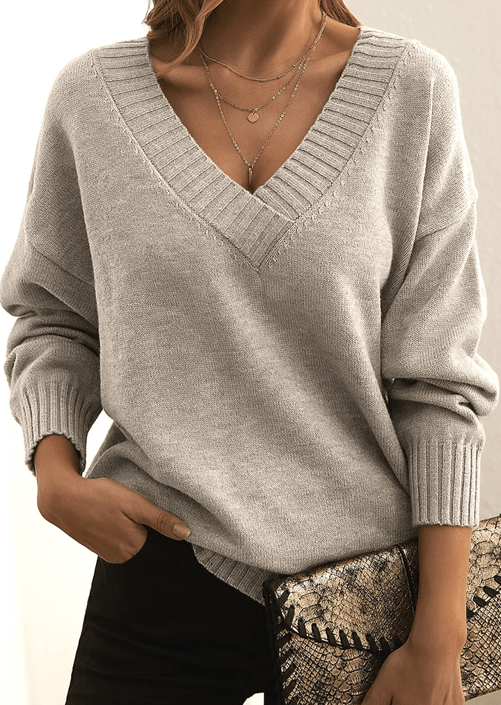 Pullover donna con scollo a V, design classico e confortevole per la moda invernale.