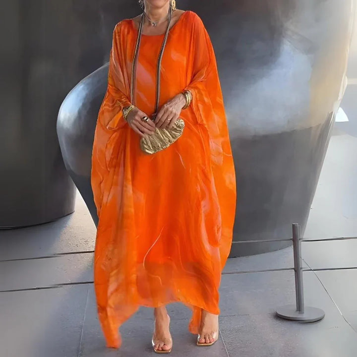 Abito maxi da donna in stile elegante e casual chic, con maniche a cappa, disponibile in vari colori.
