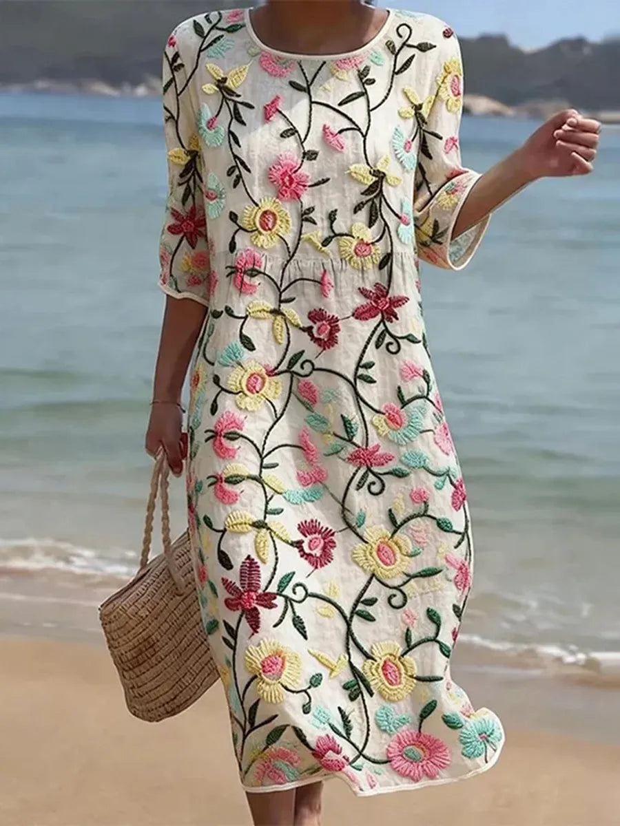 Abito midi donna con scollo rotondo e maniche tre quarti, ricamato floreale. Stile elegante per l'estate.