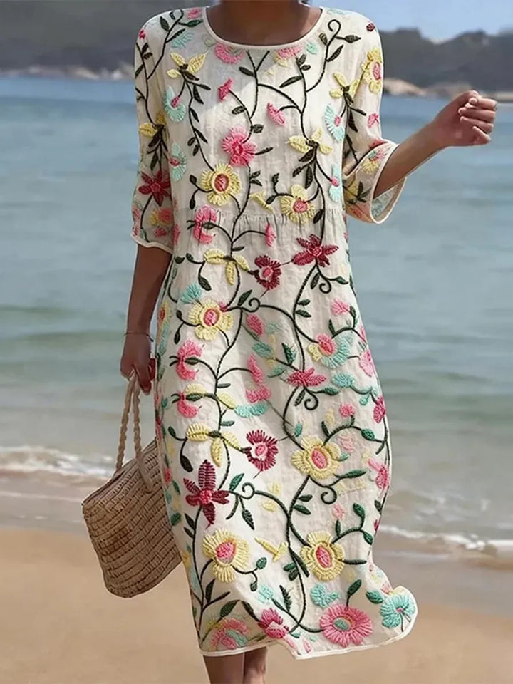 Abito midi donna con scollo rotondo e maniche tre quarti, ricamato floreale. Stile elegante per l'estate.