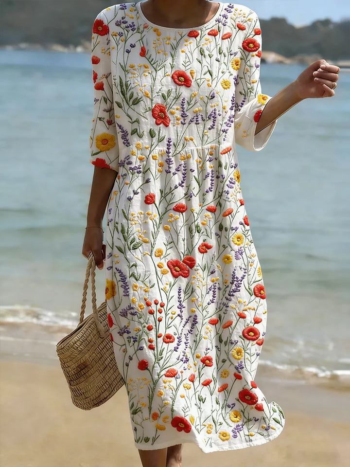 Abito midi ricamato floreale per donna, con dettagli vintage. Ideale per un outfit estivo confortevole.