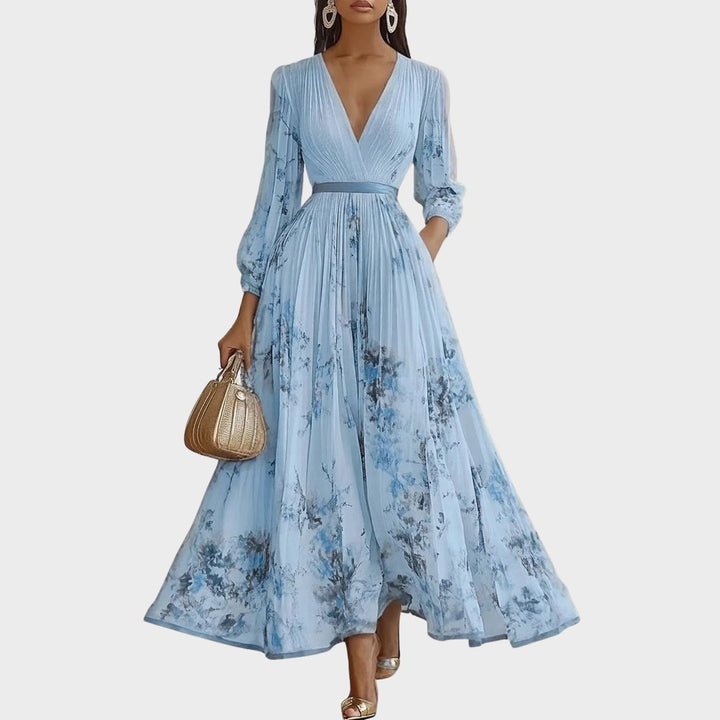 Abito da cerimonia donna con scollo V e cintura, stile fluido per invitata elegante e confortevole.