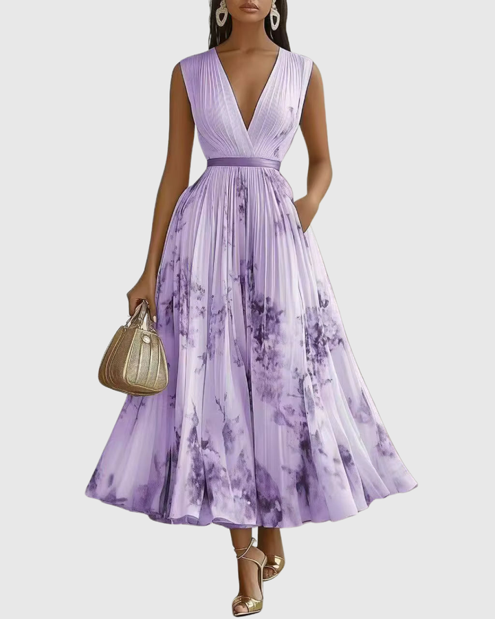 Abito da donna fluido scollo V, con cintura che enfatizza la vita, perfetto per cerimonie eleganti.