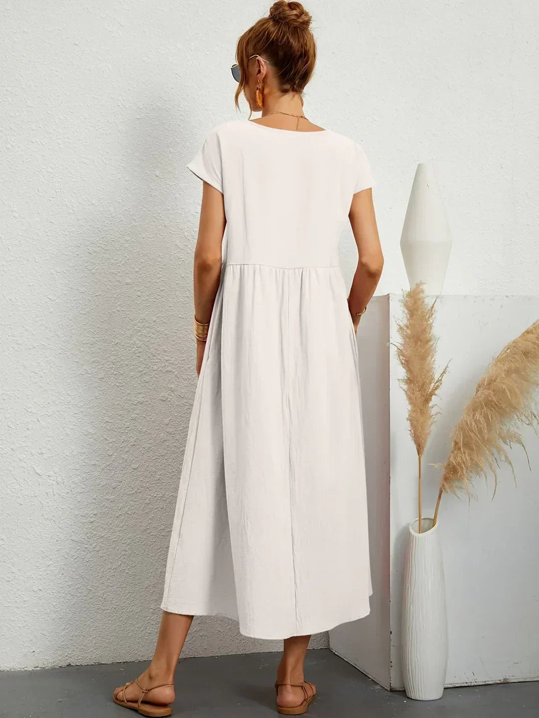 Abito midi donna maniche kimono, scollo rotondo, tasche, ideale per l'autunno e la versatilità.